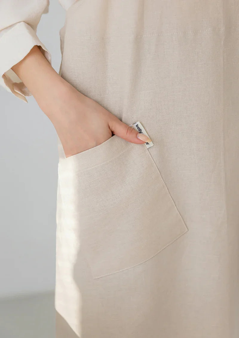 Front pocket detail on a beige Belly Armor premium linen EMF apron