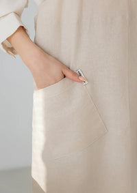 Front pocket detail on a beige Belly Armor premium linen EMF apron