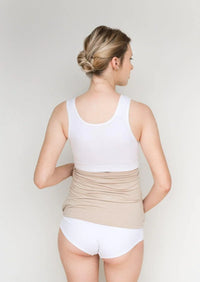 Back view of a beige Belly Armor adjustable maternity EMF belly band