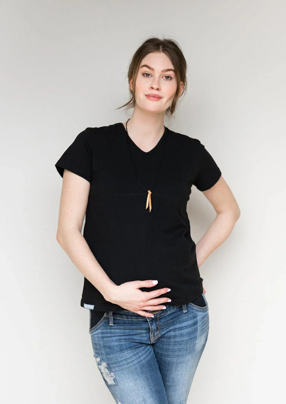 Front view of a black Belly Armor V-neck EMF protection maternity tee